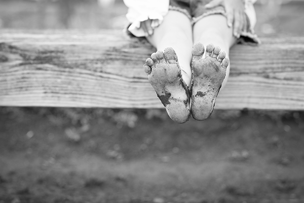 Child with muddy feet